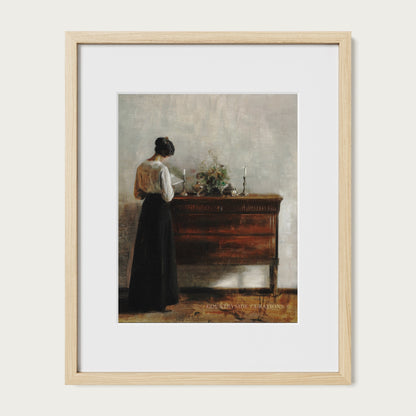 Classic interior oil painting of a woman in a long dress reading at a wooden console with soft shadows.