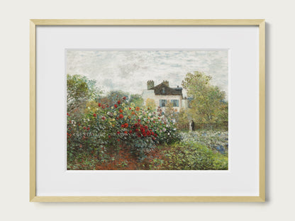 Framed painting of a garden scene with a house in the background on a white wall.