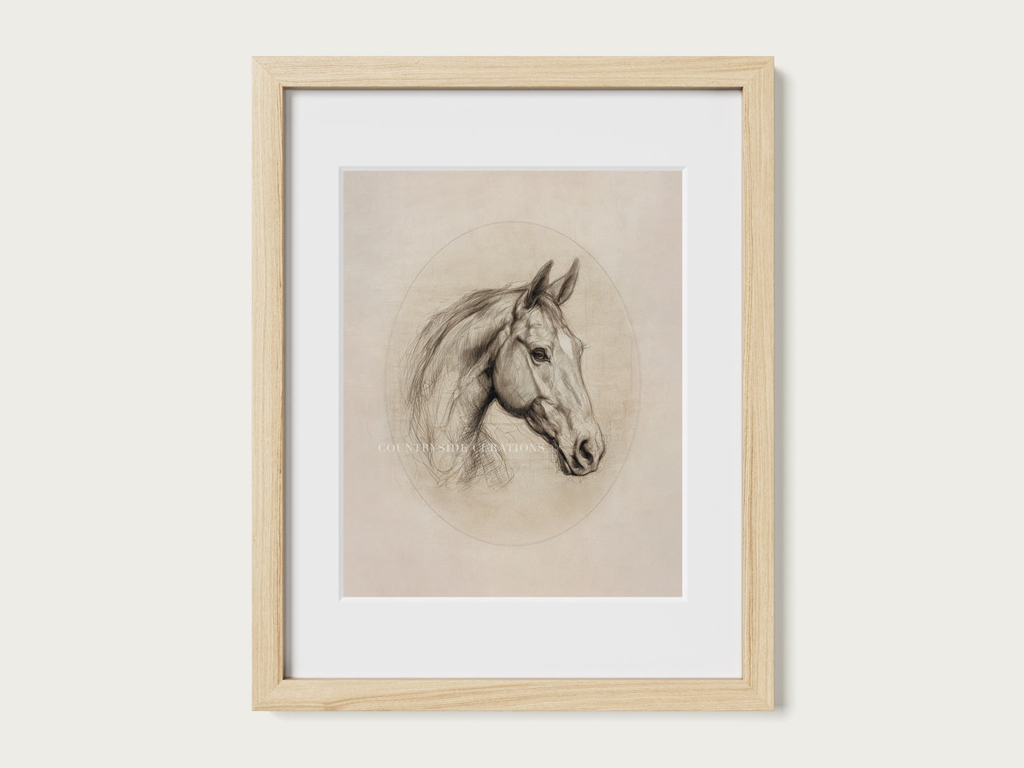 Framed drawing of a horse's head on a white wall